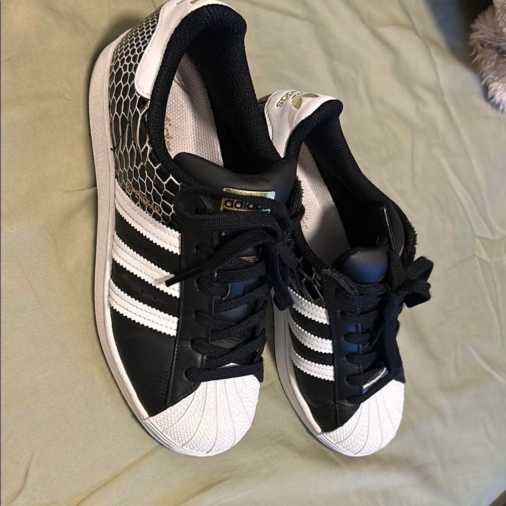 Adidas Black and White Sneakers with Iconic Stripes
